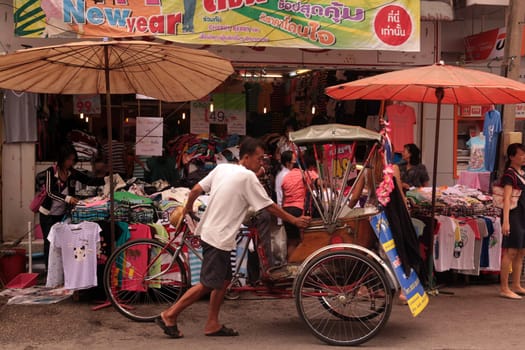 riksha taxi at the Talat Warorot in the city of chiang mai in the north of Thailand in Southeastasia. ...