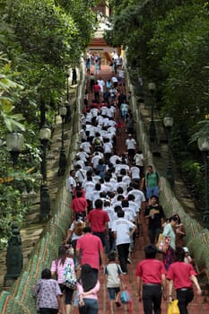 People walk to Wat Phra That Doi Suthep Temple in Chiang Mai in northern Thailand.