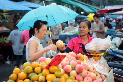 People at the Talat Warorot in the city of chiang mai in the north of Thailand in Southeastasia. ...
