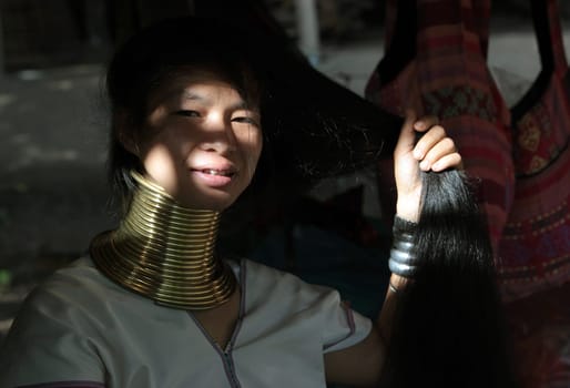 a traditional longneck women of the Paudang minority from Burma in a village north of chiang mai in the north of Thailand in Southeastasia. ...