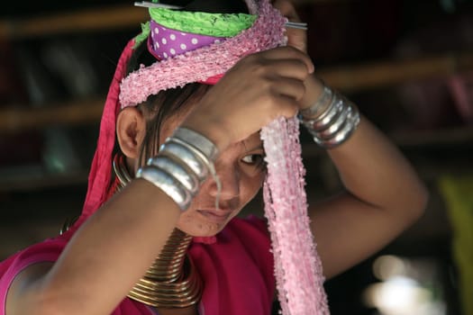 a traditional longneck women of the Paudang minority from Burma in a village north of chiang mai in the north of Thailand in Southeastasia. ...