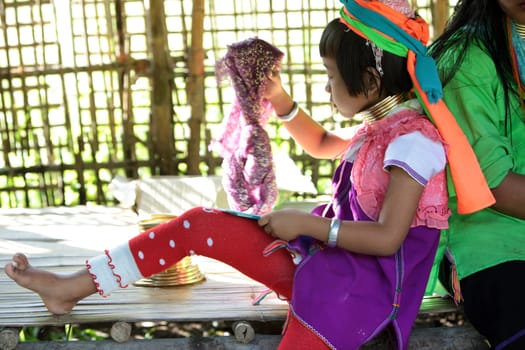 a traditional longneck women of the Paudang minority from Burma in a village north of chiang mai in the north of Thailand in Southeastasia. ...