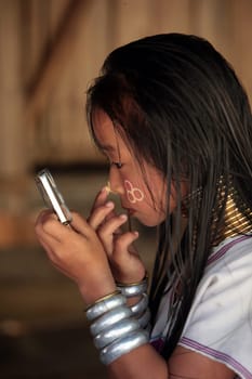 a traditional longneck women of the Paudang minority from Burma in a village north of chiang mai in the north of Thailand in Southeastasia. ...