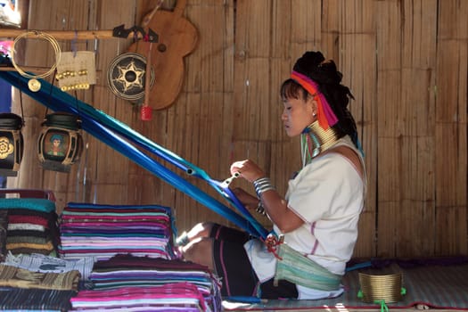 a traditional longneck women of the Paudang minority from Burma in a village north of chiang mai in the north of Thailand in Southeastasia. ...