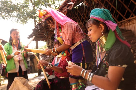 a traditional longneck women of the Paudang minority from Burma in a village north of chiang mai in the north of Thailand in Southeastasia. ...