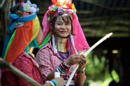 a traditional longneck women of the Paudang minority from Burma in a village north of chiang mai in the north of Thailand in Southeastasia. ...