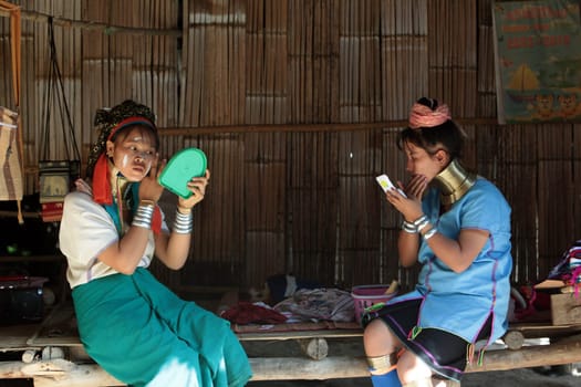 a traditional longneck women of the Paudang minority from Burma in a village north of chiang mai in the north of Thailand in Southeastasia. ...