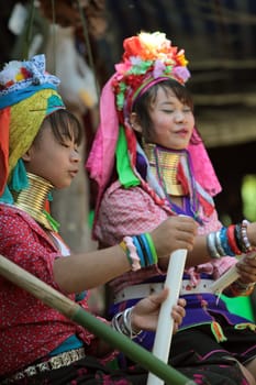 a traditional longneck women of the Paudang minority from Burma in a village north of chiang mai in the north of Thailand in Southeastasia. ...