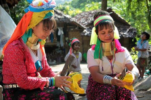 a traditional longneck women of the Paudang minority from Burma in a village north of chiang mai in the north of Thailand in Southeastasia. ...