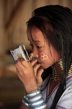 a traditional longneck women of the Paudang minority from Burma in a village north of chiang mai in the north of Thailand in Southeastasia. ...