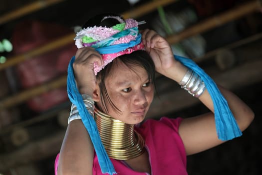 a traditional longneck women of the Paudang minority from Burma in a village north of chiang mai in the north of Thailand in Southeastasia. ...