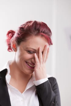 beautiful redhaired office girl worker smiling or laughing