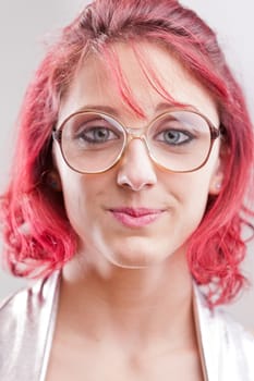 red haired girl with big glasses and a funny candid expression