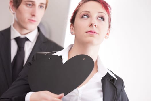 business man loving busines woman and offering a heart