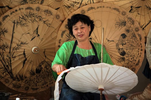 an Umbrella Factory near the city of chiang mai in the north of Thailand in Southeastasia. ...
