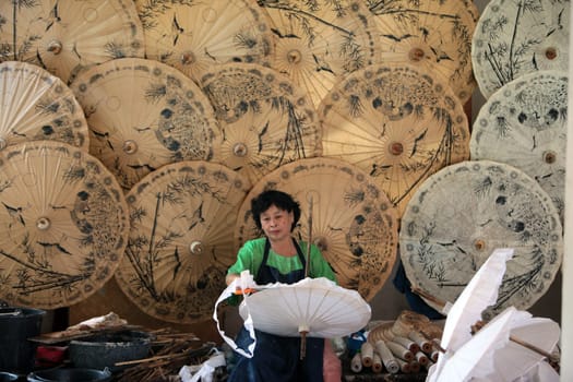 an Umbrella Factory near the city of chiang mai in the north of Thailand in Southeastasia. ...