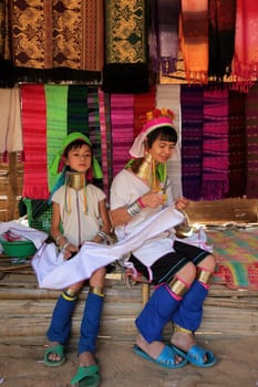 a traditional longneck women of the Paudang minority from Burma in a village north of chiang mai in the north of Thailand in Southeastasia. ...