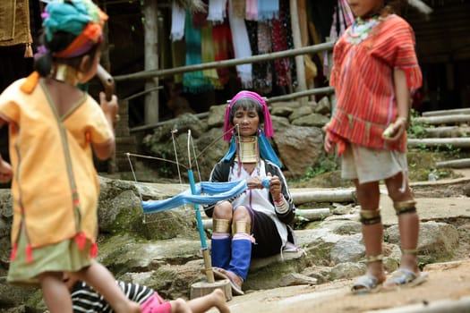 a traditional longneck women of the Paudang minority from Burma in a village north of chiang mai in the north of Thailand in Southeastasia. ...