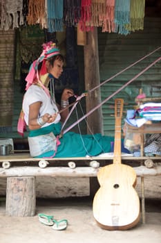 a traditional longneck women of the Paudang minority from Burma in a village north of chiang mai in the north of Thailand in Southeastasia. ...