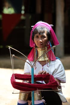a traditional longneck women of the Paudang minority from Burma in a village north of chiang mai in the north of Thailand in Southeastasia. ...