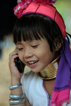 a traditional longneck women of the Paudang minority from Burma in a village north of chiang mai in the north of Thailand in Southeastasia. ...