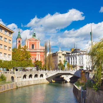 Romantic Ljubljana city center. River Ljubljanica, Triple Bridge - Tromostovje, Preseren square and Franciscan Church of the Annunciation. Ljubljana Slovenia Europe.