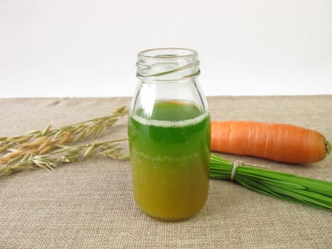 Green smoothie with oat grass and carrot