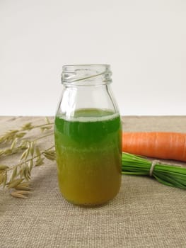Green smoothie with oat grass and carrot