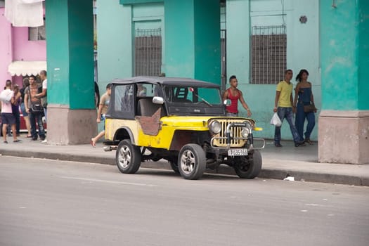 the old classic american car along the street at the Old Havana