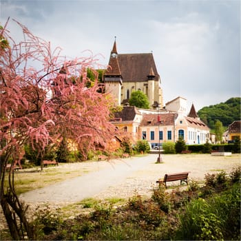 Street view of medieval Saxon village of Biertan with fortified church  in Romania .In Transylvania region