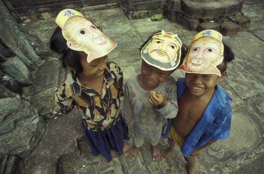 childern in a temple in Angkor at the town of siem riep in cambodia in southeastasia.