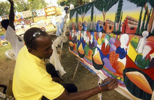 A Painter at the Village of Las Terrenas on Samanaon in The Dominican Republic in the Caribbean Sea in Latin America.