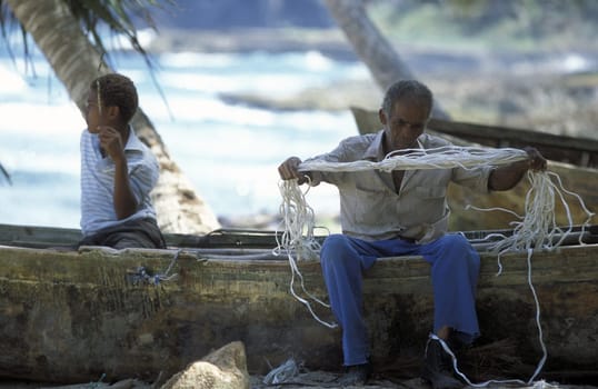 A Fishermen at the Village of Las Terrenas on Samanaon in The Dominican Republic in the Caribbean Sea in Latin America.
