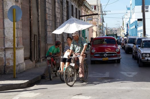 Traditional transport along the street in Moron, Cuba