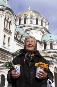 a women sales flowers at the Nevski church in the city of Sofia in Bulgaria in east Europe.
