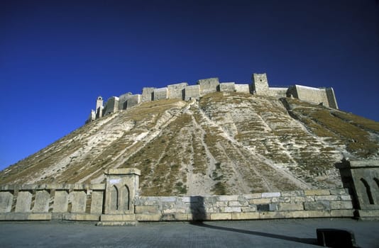 The citadel in the Old City of Aleppo in northern Syria in the Middle East in Arabia.