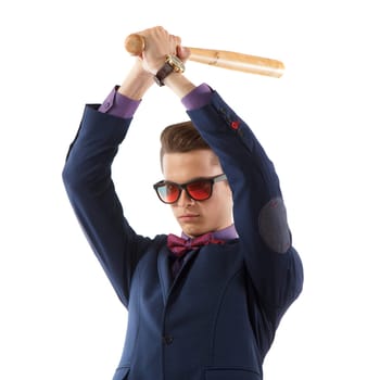 A young adult wearing a suit with shades and a baseball bat