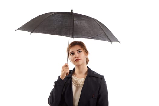 An elegant lady holding a black umbrella