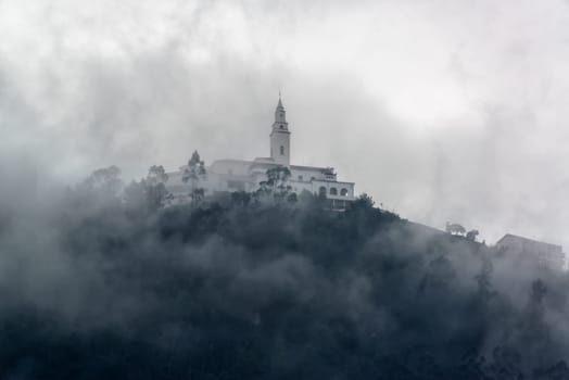 Monserrate church in the Andes Mountains covered in fog high above Bogota, Colombia
