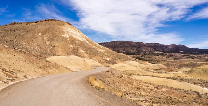 The road winds through colorful mineral and rock deposits in Oregon