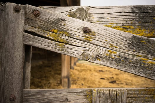 Close up of a weathered wood farm gate