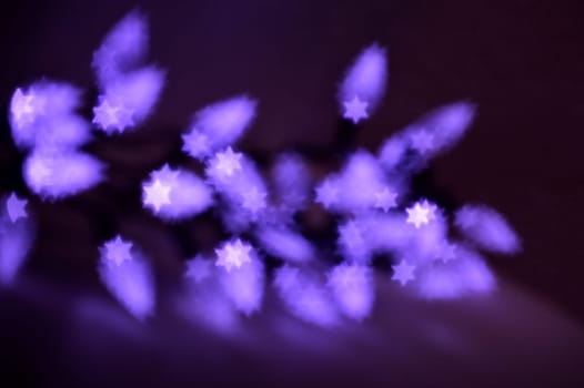 Beautiful bokeh lights in shape of the Star of David for Hanukkah celebration. Jewish Holiday background.