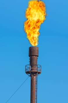 Chimney for controlled burning of excess gas.