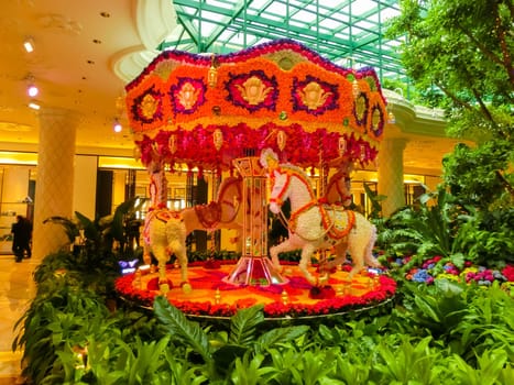 Las Vegas, United States of America - May 06, 2016: Flowers installation French carousel at the Wynn Hotel and casino in Las Vegas. The installation made of 110,000 flowers and designed by Preston Bailey