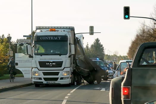 Accident of a heavy-duty transporter in the city center of Magdeburg. The cargo slipped and crashed onto the road