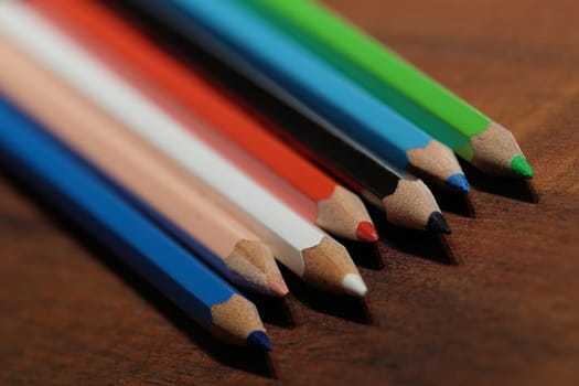 colorful pencils lie on a table
