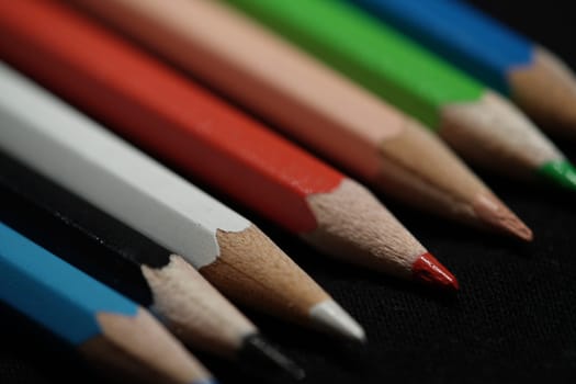 colorful pencils lie on a table