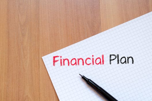 Financial plan text concept write on notebook