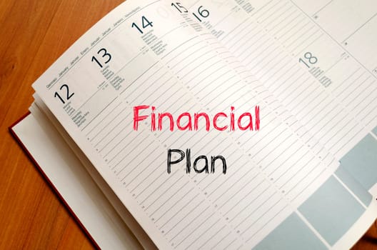 Financial plan text concept write on notebook