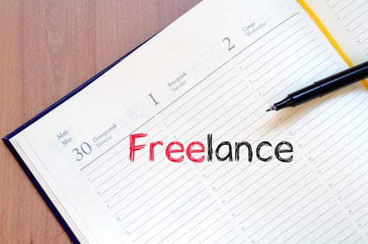 Freelance text concept write on notebook